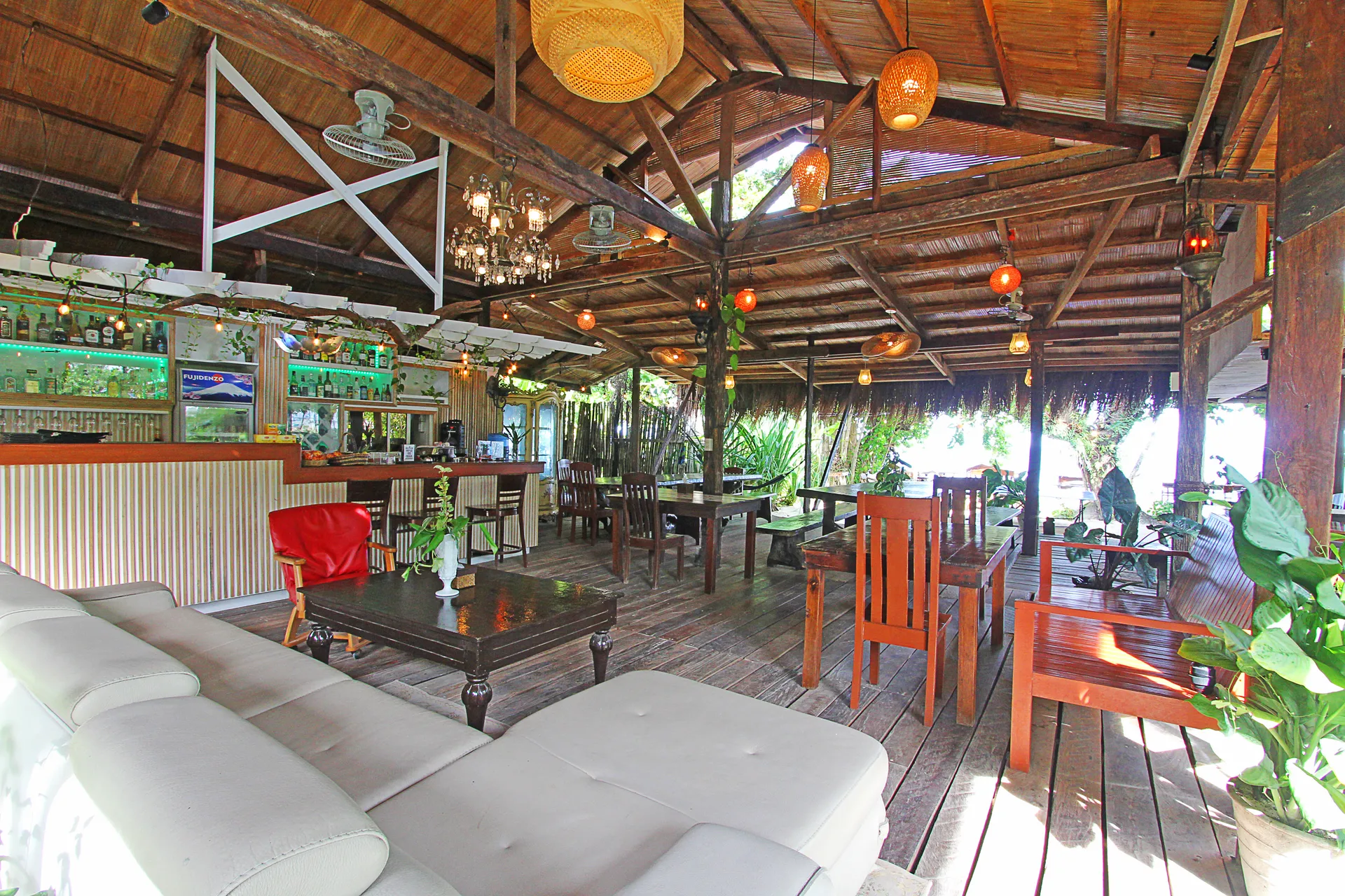 Open-air beachfront restaurant at Patrick's on the Beach, Siargao, set for dinner by the sand