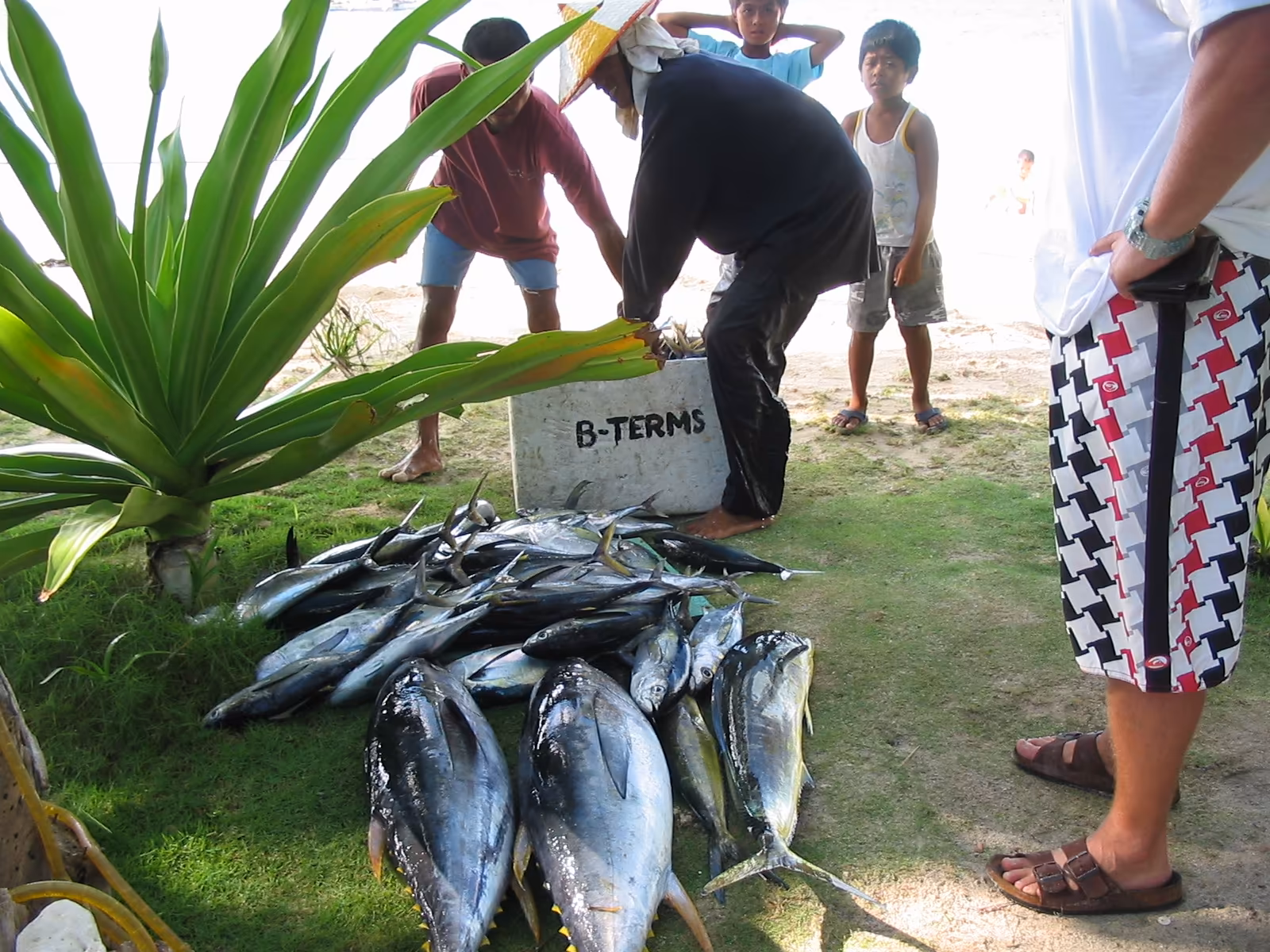 Guests reeling in a catch on a Siargao fishing charter