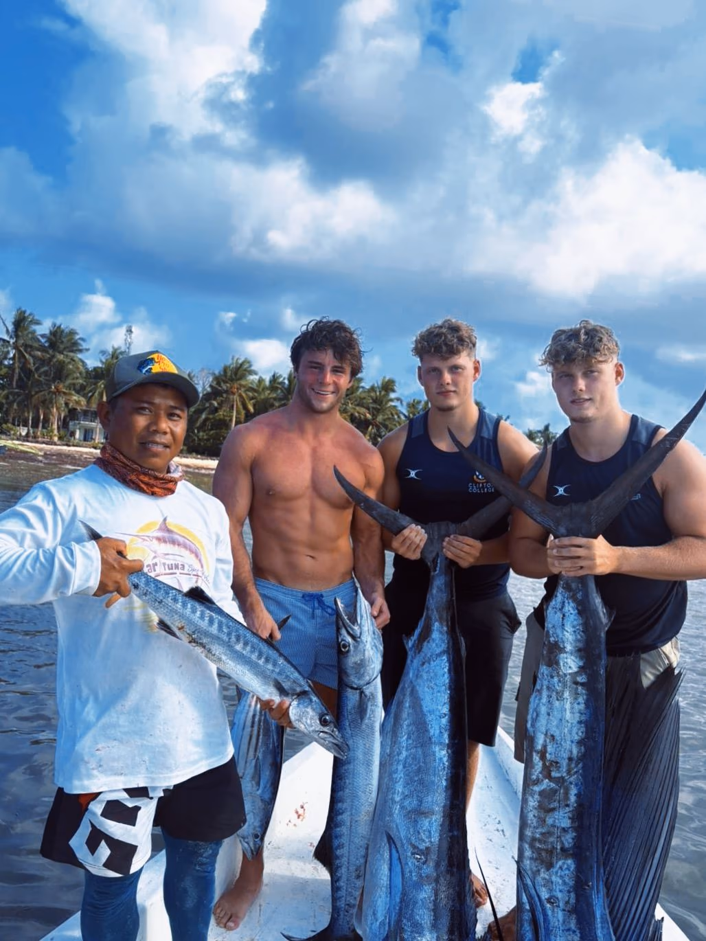 Fresh catch held up on a Siargao deep sea fishing trip
