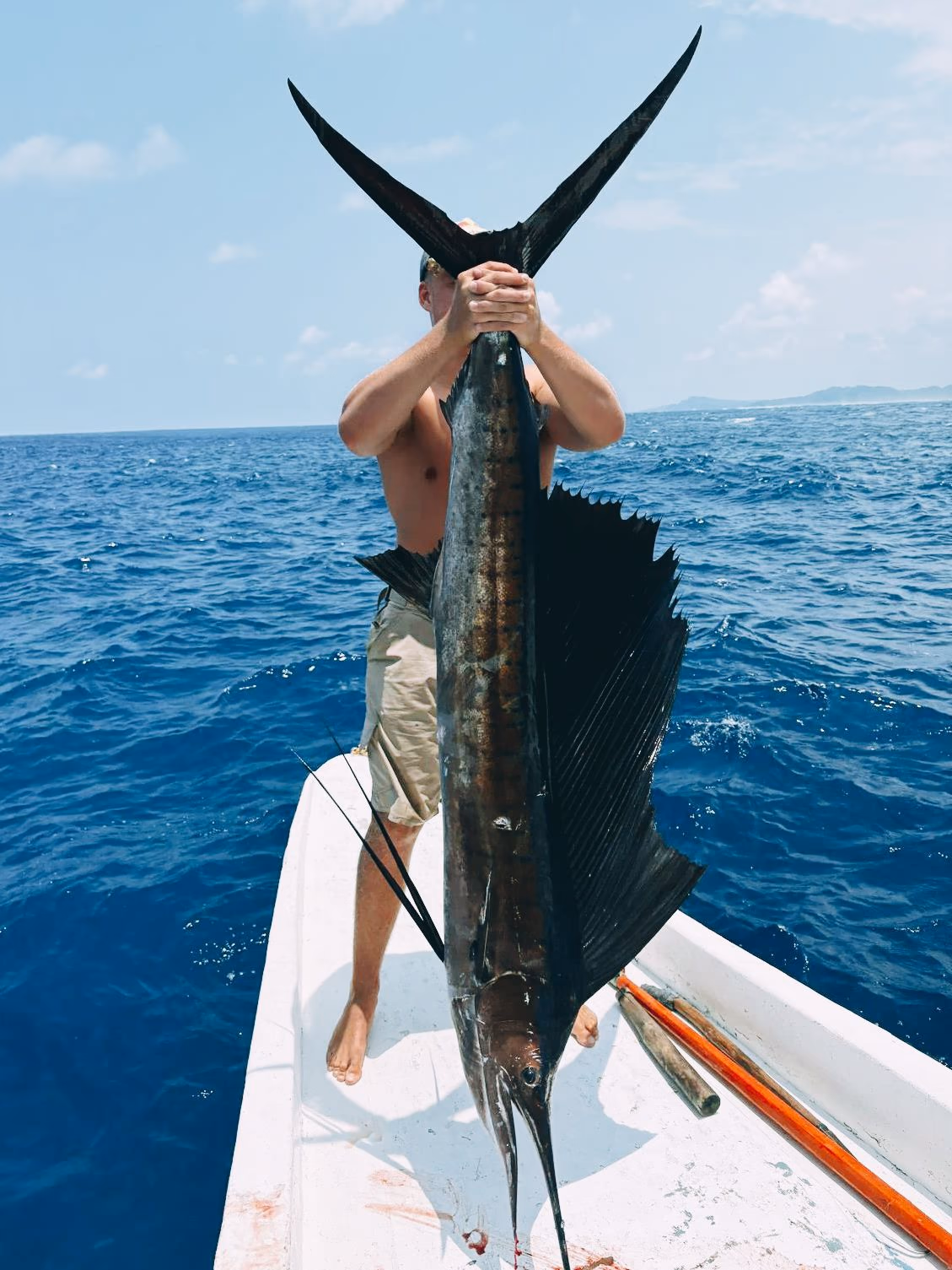 Guests with their catch aboard a Patrick's fishing boat off Siargao