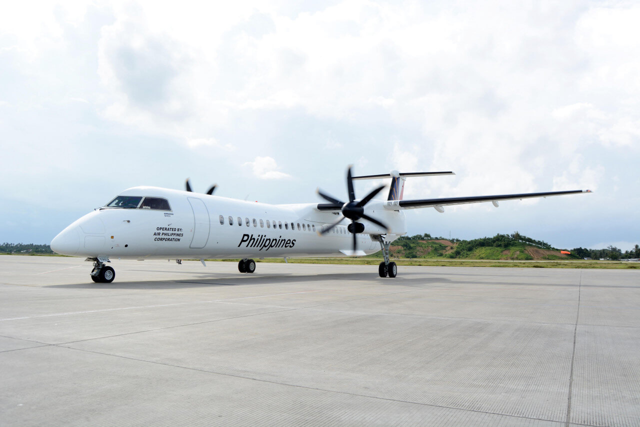 Philippine Airlines turboprop plane on the tarmac after landing on Siargao Island